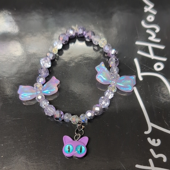 Handmade Jewelry - Purple Beaded Crystal Bracelet with Bows And Cat Charm
